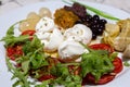 Mediterranean cuisine salad with mozzarella olives artichokes onions Royalty Free Stock Photo
