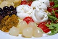 Mediterranean cuisine salad with mozzarella olives artichokes onions Royalty Free Stock Photo