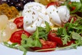 Mediterranean cuisine salad with mozzarella olives artichokes onions Royalty Free Stock Photo