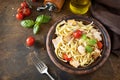 Mediterranean cuisine, seafood diet. Italian spaghetti pasta savory salmon with bechamel sauce on a rustic tabletop. Copy space