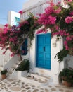 Captivating Greek House with White Walls, Blue Accents, and Blooming Pink Flowers