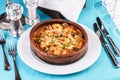 Seafood stew soup- shrimp, fish meat and mushrooms, with cheese and greens Royalty Free Stock Photo