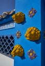 Mediterranean facade in blue with yellow lion tiles