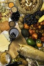 Mediterranean Food background. Assortment of fresh fish, fruits and vegetables, glass of red wine. Top view Royalty Free Stock Photo