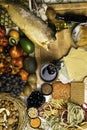 Mediterranean Food background. Assortment of fresh fish, fruits and vegetables, glass of red wine. Top view Royalty Free Stock Photo