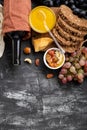 Mediterranean food drinks Ingredients set for dinner. Wine honey cheese nuts snacks bread grapes fruit on dark black
