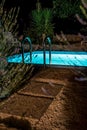 Mediterranean Garden With Illuminated Pool In The Night Royalty Free Stock Photo