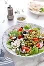 Mediterranean Greek and chickpea salad with fresh vegetables and feta cheese Royalty Free Stock Photo