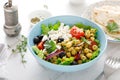 Mediterranean Greek and chickpea salad with fresh vegetables and feta cheese Royalty Free Stock Photo