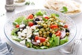 Mediterranean Greek and chickpea salad with fresh vegetables and feta cheese Royalty Free Stock Photo