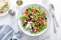 Mediterranean Greek and chickpea salad with fresh vegetables and feta cheese Royalty Free Stock Photo