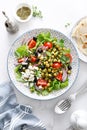 Mediterranean Greek and chickpea salad with fresh vegetables and feta cheese Royalty Free Stock Photo