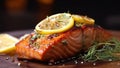 A Mediterranean grilled salmon steak with a few herbs. A slice of grilled salmon seasoned with rosemary. Restaurant photograph