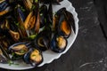 Mediterranean paleo diet food concept. Steamed mussels on dark background. Royalty Free Stock Photo