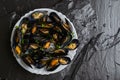 Mediterranean paleo diet food concept. Steamed mussels on dark background. Selective focus Royalty Free Stock Photo