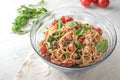Mediterranean party salad from spaghetti with tomatoes, arugula, mozzarella, olives and basil in a glas bowl on a white painted Royalty Free Stock Photo