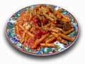 Mediterranean pasta with fresh tomato cheese and sausage sauce sprinkled with herbs Royalty Free Stock Photo