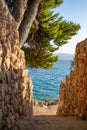 Mediterranean path heading down to blue sea water