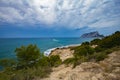 Mediterranean pines in a city park in Moraira overlooking Playa El Portet beach in Mediterranean Alicante, Spain Royalty Free Stock Photo