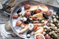 Mediterranean, raw seafood mix on a metal plate. Marine composition, selective focus. Fish shop assortment.