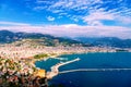 Mediterranean region, Alanya, Turkey. Scenic view of the city, mountains, sea and harbour under cloudy blue sky