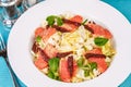 Mediterranean salad. Cabbage, tomatoes, smoked seeds, olives, olives, basil and rosemary, seasoned with olive oil and balsamic sau Royalty Free Stock Photo