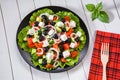 Mediterranean salad with feta cheese, tomatoes, cucumbers and olives Royalty Free Stock Photo