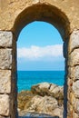 Mediterranean sea through the arch in Cefalu