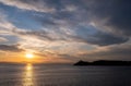 Mediterranean sea. Beautiful sunset and a lighthouse at Kea island, Greece Royalty Free Stock Photo