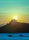 Mediterranean sea. Beautiful sunset and a lighthouse at Kea island, Greece. Royalty Free Stock Photo