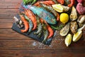 Mediterranean sea cuisine background with a royal and tiger shrimps, oysters, fish