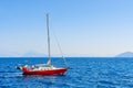 MEDITERRANEAN SEA, GREECE- SEP 19, 2014: red yacht boat sailing on blue sea near Kefalonia island. Greek islands are popular