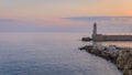 Mediterranean Sea with the lighthouse at sunset in the harbor, Nice, France Royalty Free Stock Photo