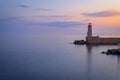 Mediterranean Sea with the lighthouse at sunset in the harbor, Nice, France Royalty Free Stock Photo