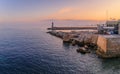 Mediterranean Sea with the lighthouse at sunset in the harbor, Nice, France Royalty Free Stock Photo