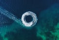 Mediterranean sea. Seascape with scooter. Aerial view of floating scooter on blue sea at sunny day. Top view from drone at beach a