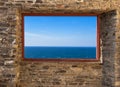 Mediterranean Sea view through old stone window, Spain Royalty Free Stock Photo