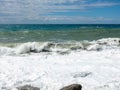 Mediterranean Sea waves crashing over rocks on a beach in stormy weather Royalty Free Stock Photo