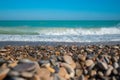 Mediterranean sea with waves with stony beach.