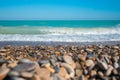 Mediterranean sea with waves with stony beach.