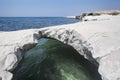 Mediterranean sea. White stone arch near Governor`s beach Royalty Free Stock Photo