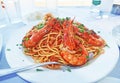 mediterranean seafood - pasta with shrimps at a greek tavern