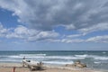 Small Boat and Surf on the Beach near Haifa Royalty Free Stock Photo