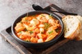 Mediterranean soup of seafood and white fish with shrimp, mussels, scallops, squid close-up in a bowl. horizontal