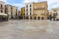 Mediterranean square with ancient buildings. Italian traditional architecture. Bari town landmark. Vastness concept.