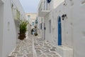 Mediterranean street with white houses and blue doors