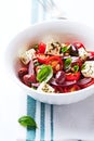 Mediterranean-style Cherry tomato Salad with Kalamata Olives, Feta Cheese and Pine Nuts