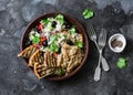 Mediterranean style lunch - couscous, cherry tomatoes, cucumbers, feta cheese, olives salad and lemon herbs roasted chicken breast Royalty Free Stock Photo