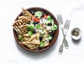 Mediterranean style lunch - couscous, cherry tomatoes, cucumbers, feta cheese, olives salad and lemon herbs roasted chicken breast Royalty Free Stock Photo