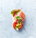 Mediterranean-style open sandwich with Serrano Ham, Tomato, Gren Olives, Basil leaves and Red Sorrel Royalty Free Stock Photo